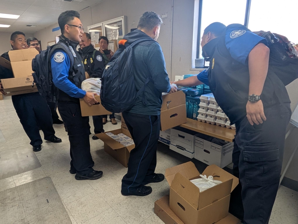 TSA employees pick up food delivered by ACCFB in the breakroom of the Oakland Airport on October 16, 2025.