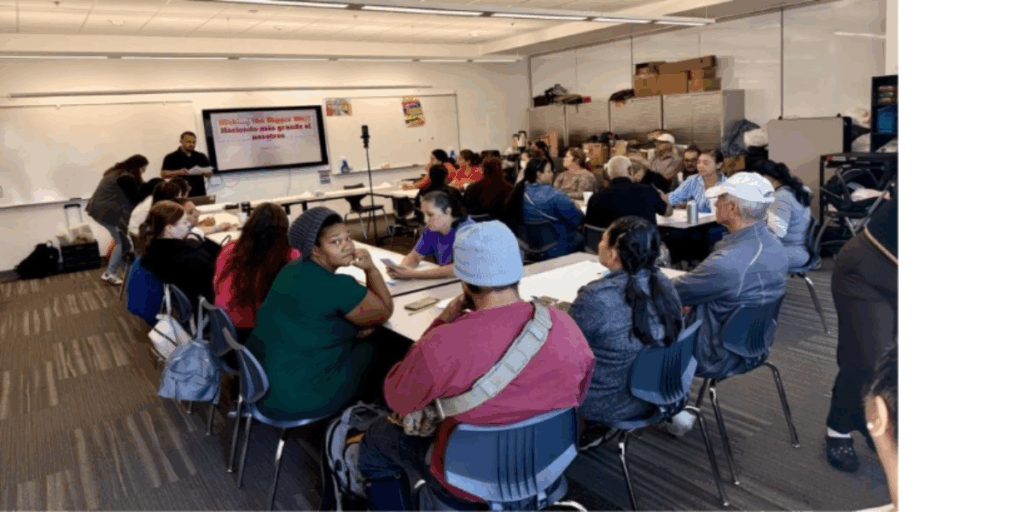 Community organizers sitting at a meeting