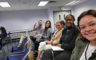 Community organizers smiling in a selfie
