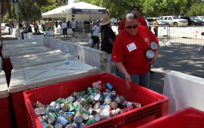 A volunteer sorts cans at a food drive at the Alameda County Fair