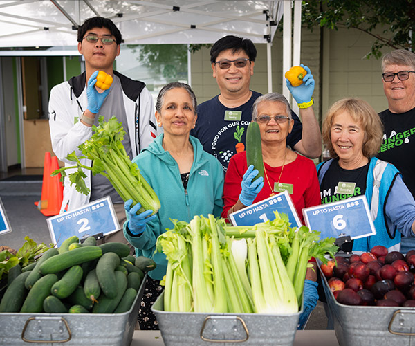 Media-Text-image-600×500 Food bank staff member delivering fresh carrots